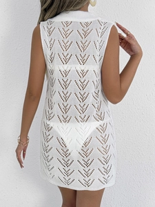 Rear view of white hollow-knit polo neck beach dress showing intricate geometric patterns
