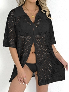 Detail of black crochet knit texture on long sleeve polo beach cover up with button closure