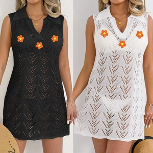 Detail of hollow out crochet mini dress with floral patches and a V-neck polo collar