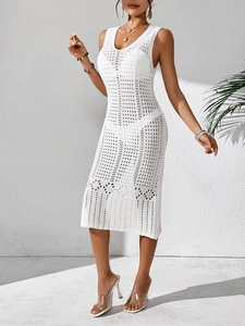 Macro shot of white crochet weave pattern and hollow geometric knit on the dress