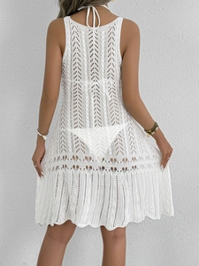 Back view of white crochet hollow beach cover-up dress with halter neck design