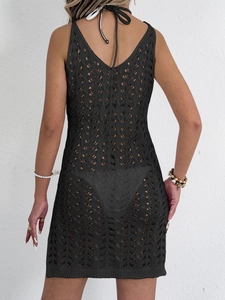 Detail of hollow-out knit pattern on black backless beach cover-up dress for women