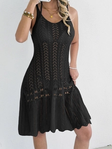 Detailed close-up of a black crochet knit sleeveless beach cover-up with hollow patterns