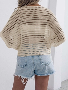 Detailed back view of beige crochet hollow out knit top with batwing sleeves