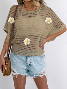 Detail of hollow-out knit top with 3D woven white flowers in bohemian vacation style