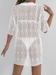 Detailed back view of a white crochet beach cover-up with intricate diamond hollow patterns
