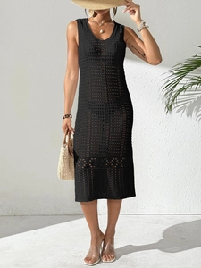 Detail of black hollow out knit dress featuring V-neck and sleeveless crochet pattern