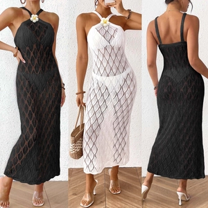 Detail of crochet halter dress featuring floral neckline and diamond knit patterns