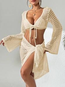 Women crochet beach set with V-neck long sleeve top and side tie wrap skirt in cream white