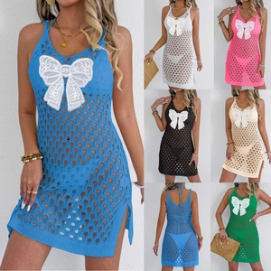Detailed close-up of crochet lace butterfly embroidery and hollow out knit beach dress