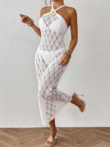 Women's white halter crochet beach dress with leaf pattern and floral detail