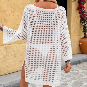 Close-up of white waffle knit beach cover-up showing hollow crochet texture and side slit