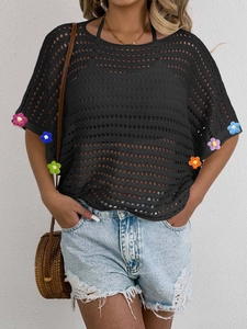 Women's black hollow crochet knit top with colorful 3D floral accents on batwing sleeves