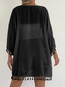 Close-up of lightweight black chiffon kimono cover-up with delicate fringe trim details