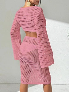 Pink bohemian knit two-piece beach set featuring long sleeve crop top and midi skirt