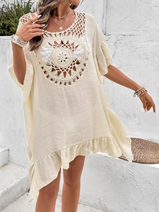 Bohemian light beige beach cover up dress with crochet sunburst detail and tassel trim
