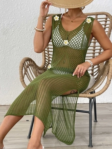 Detail of olive green crochet cover-up dress with white 3D floral appliques and side slit