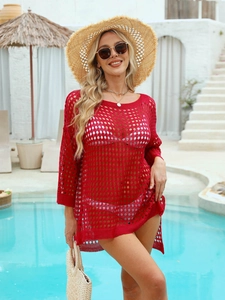 Detailed texture of red hollow waffle knit beach cover up with a round neck design