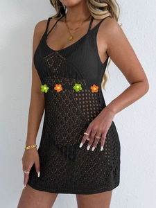 Detail of black crochet mini dress with hollow mesh and 3D floral waist appliques