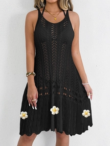 Black crochet mini dress with halter neck and white daisy appliques for beachwear