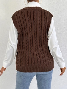 Rear view of brown cable-knit vest showing intricate knit patterns and ribbed edges