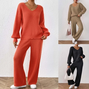Detail of soft ribbed knit texture on V-neck sweater and wide-leg pants set in three colors