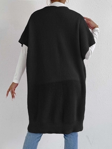 Back view of a long black knit vest with vertical ribbing and wide shoulder silhouette