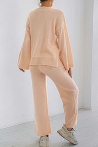 Detail of ribbed hem and side slit on dusty pink knitted sweater lounge set