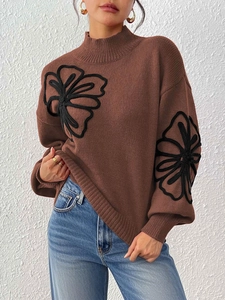 Brown high neck sweater with 3D floral embroidery and lantern sleeves on model