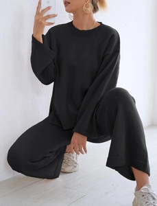 Detailed texture of black ribbed knit lounge set featuring wide-leg pants and cozy fabric