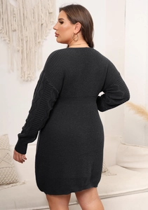 Detail view of charcoal knit dress showing unique cable knitted sleeves and slim fit design