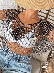 Black hollow crochet cover-up with silver beaded tassels for beach and bikini styling
