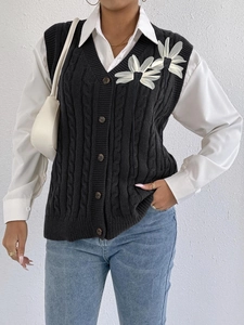 Women's black cable knit V-neck vest with vintage buttons and 3D floral appliques