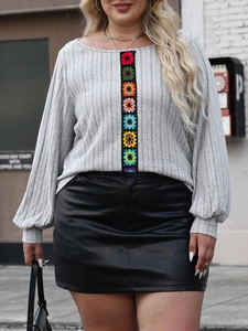 Plus size grey knit long sleeve top with colorful crochet floral patches and leather skirt