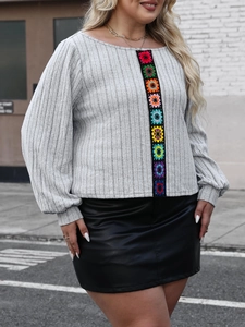Women's grey long sleeve knit top with colorful crochet floral patchwork and ribbed texture