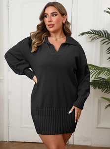 Detailed close-up of a black knit dress showing the ribbed collar and V-neckline texture