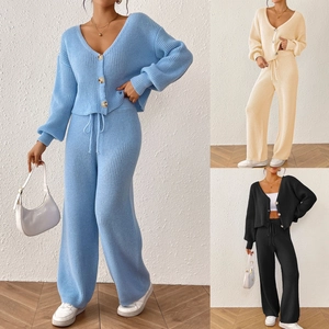 Detailed close-up of ribbed knit texture on V-neck cardigan and drawstring pants set