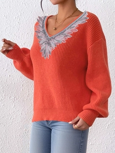 Orange V-neck ribbed knit sweater featuring silver wing embroidery and loose casual style