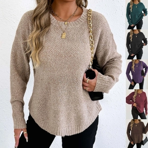 Detail showing high-quality chunky knit texture and stylish curved hem of women's sweater