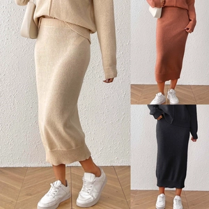 Detail view of knitted two-piece sweater and skirt set with elastic waistband design