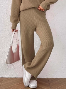 Detail view of khaki knit two-piece set featuring vertical ribbed texture and wide-leg pants