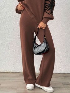 Brown knit two-piece set featuring high-waist wide-leg pants and floral embroidered sleeve