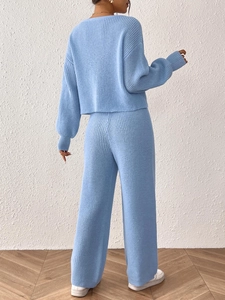 Women's light blue ribbed knit two-piece set featuring a long sleeve sweater and wide-leg pants
