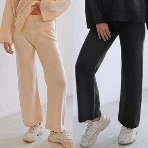 Detail of soft knitted texture and minimalist design on these wide-leg casual pants