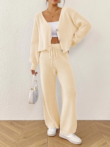 Women's cream knit two-piece set featuring V-neck button cardigan and drawstring wide-leg pants