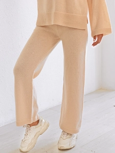 Women high waist beige knit lounge set with wide-leg pants and loose top for comfort