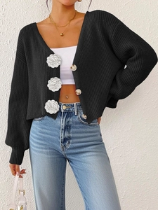 Women black chunky knit cardigan with white floral 3D applique and amber buttons