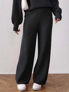 Women's black rib-knit lounge set with high-waisted wide-leg trousers and long sleeve top