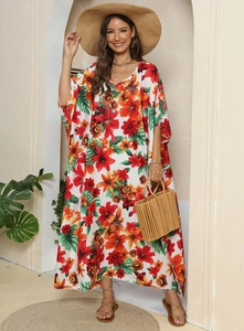 Detail of floral print maxi dress with V-neckline and loose bohemian style for vacation