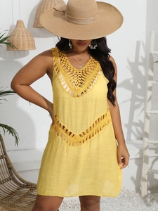 Detailed yellow crochet beach dress featuring V-neckline and hollow waist design